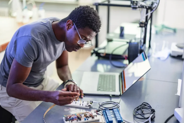 Technician working at an electronics bench