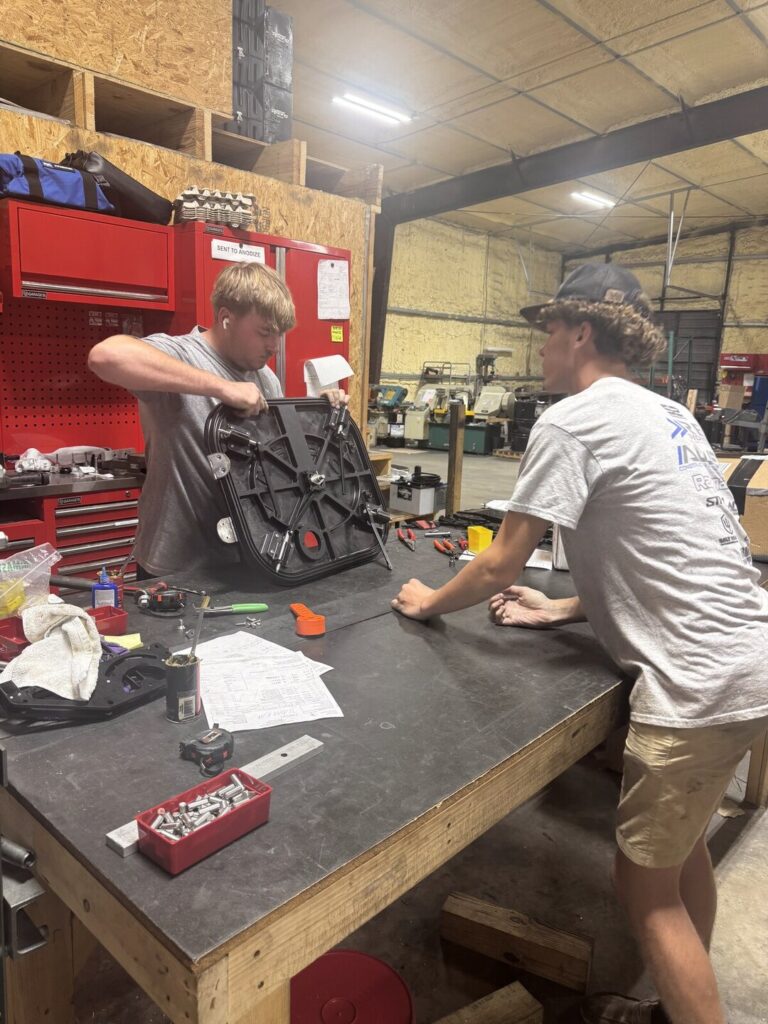 Students working together at a shop workbench