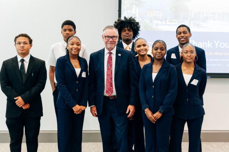 STEMCAT students in suits with a mentor